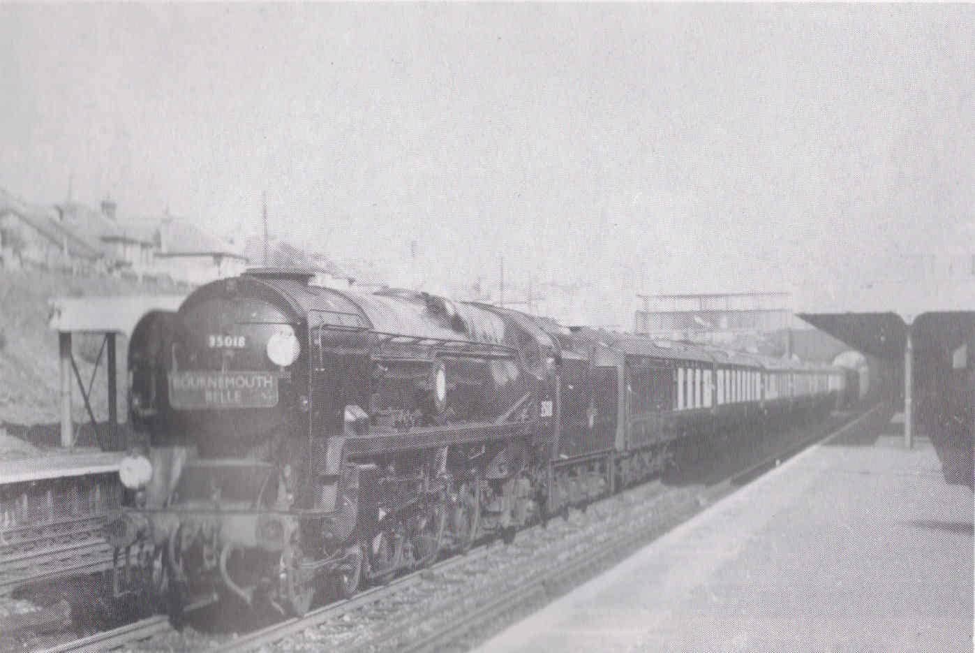 A grainy poor quality black and white photo of steam train called Bournemouth Belle.