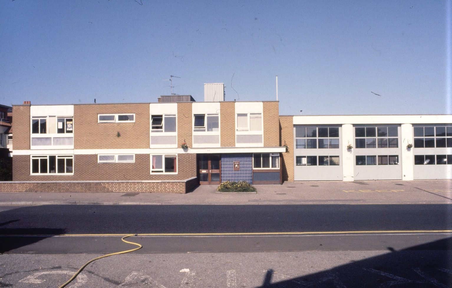 Colour photo of a beige brick two storey rectangle building which was Pokesdown Fire Station.
