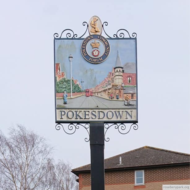 colour photo of Pokesdown sign on village green with a picture of scene from Pokesdown about 1906