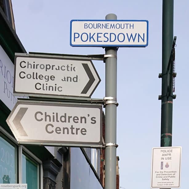 colour photo of road signs on a post, the one at the top reads "Bournemouth Pokesdown"