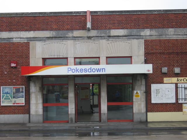 colour photo of Pokesdown Station sign at entrance in 2001