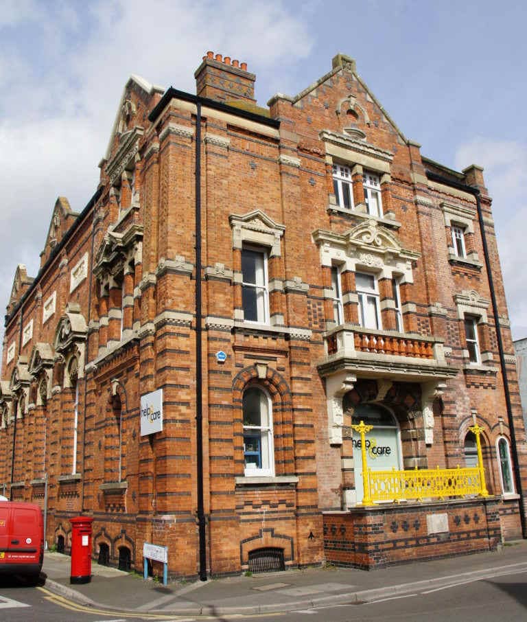 colour photo of an ornate yellow brick Victorian building