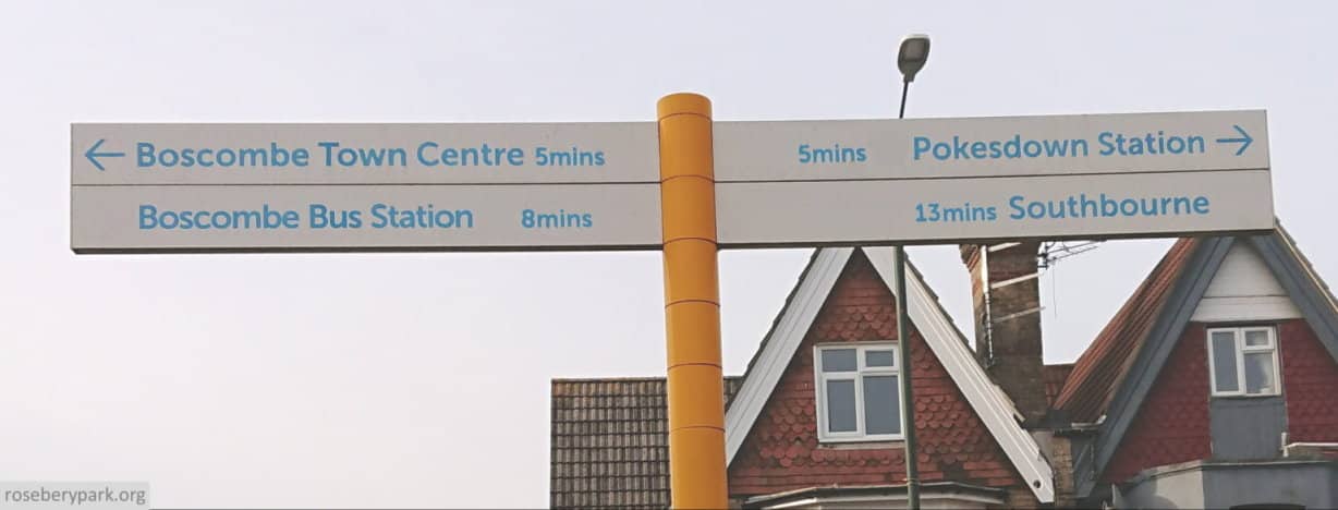 colour photo of sign at top of Parkwood Road which points to Boscombe Town centre to the left, and Pokesdown Station to the right