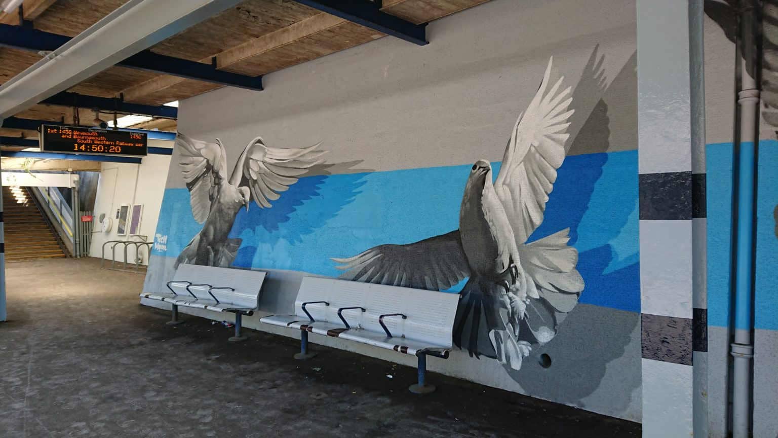 colour photo of panel one of dove mural on the wall at Pokesdown Station